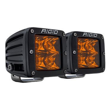 A photo of a pair of Rigid D-Series Pod Lights with Spot Optics and Amber Pro Lenses