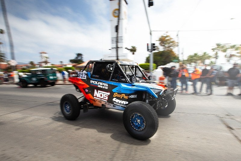 Anderson Bros team vehicle rounding street corner at NORRA 1000