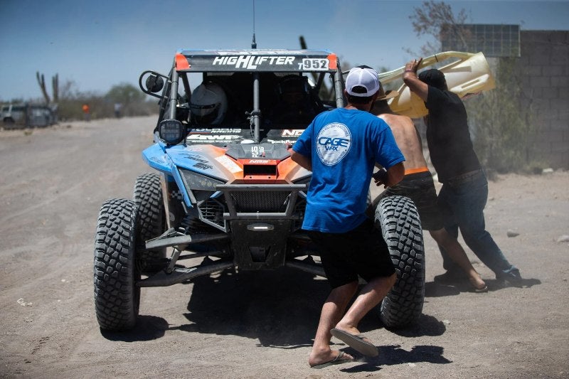 Anderson Bros team working on vehicle during NORRA 1000