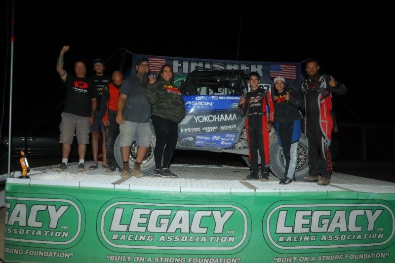 Mia Chapman and her family race team on podium