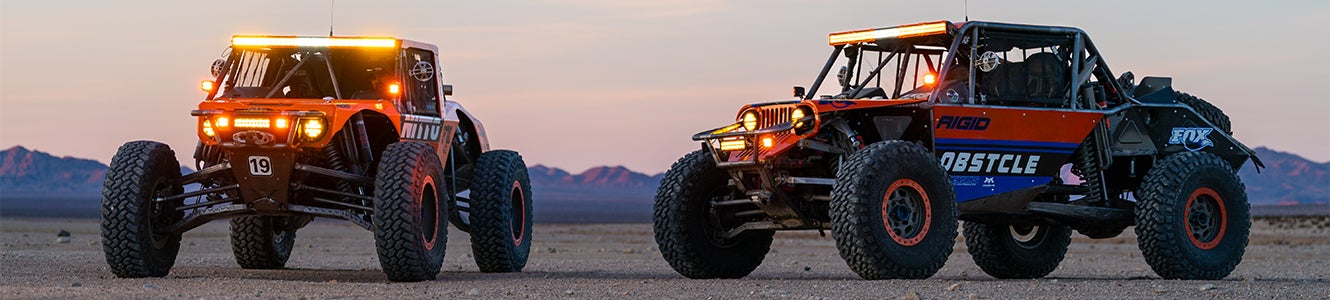 Two off-road vehicles with Rigid Amber Pro lights